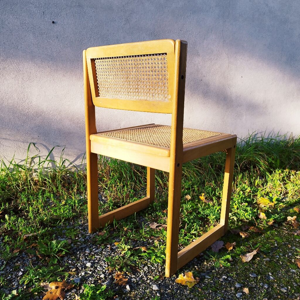 Four trendy tanned wooden chairs