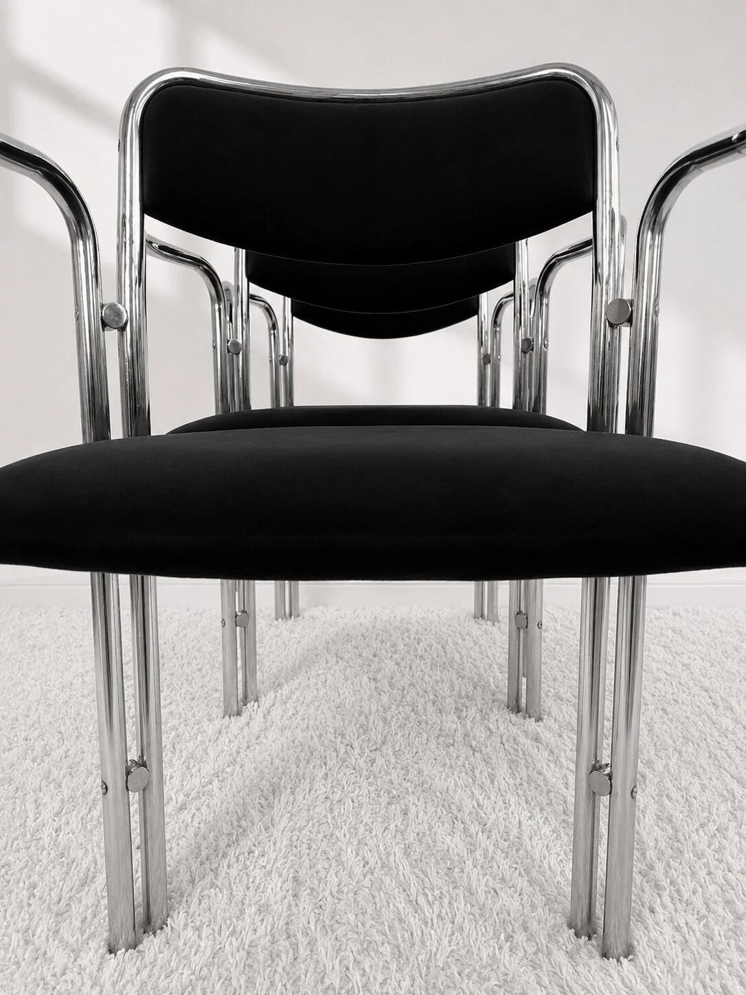 Vintage chairs with double chrome structure and black velvet. 70s