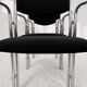 Vintage chairs with double chrome structure and black velvet. 70s