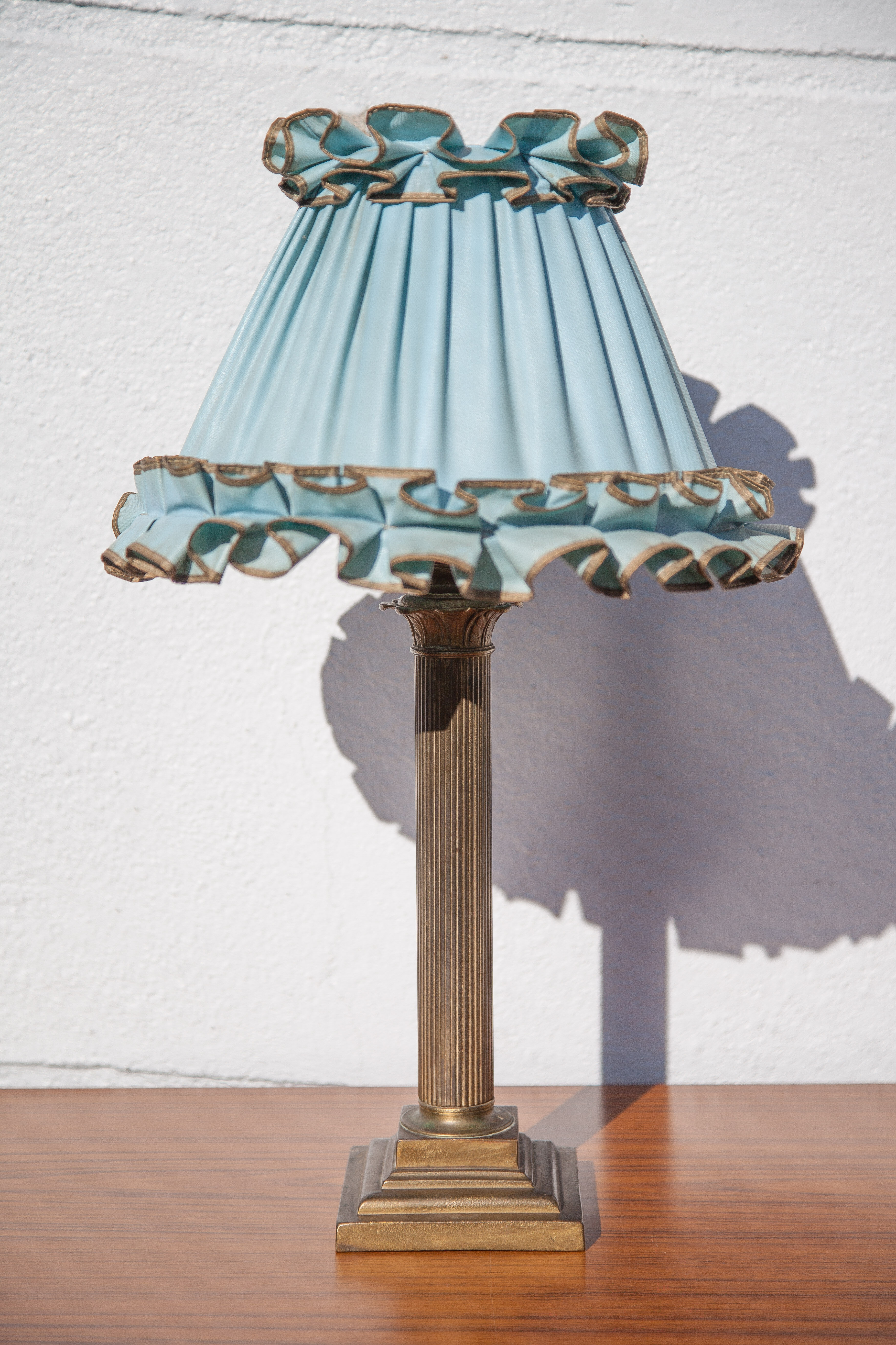 Brass lamp with vintage blue laminated lampshade