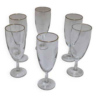 6 champagne glasses with gold rim