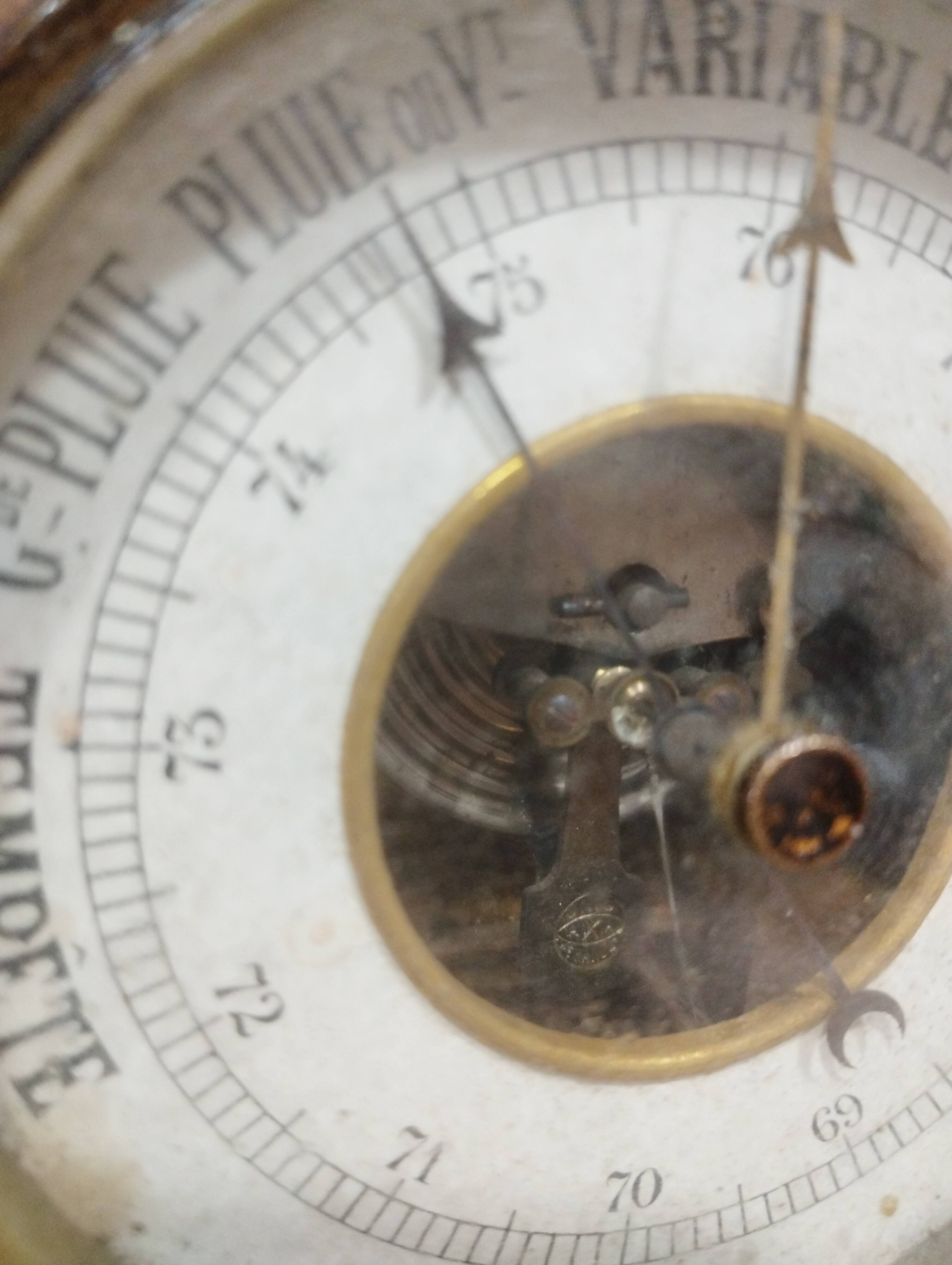 Old barometer and thermometer from the 1930s in carved wood. Signed on the back EH PARIS.