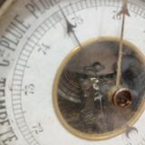 Old barometer and thermometer from the 1930s in carved wood. Signed on the back EH PARIS.