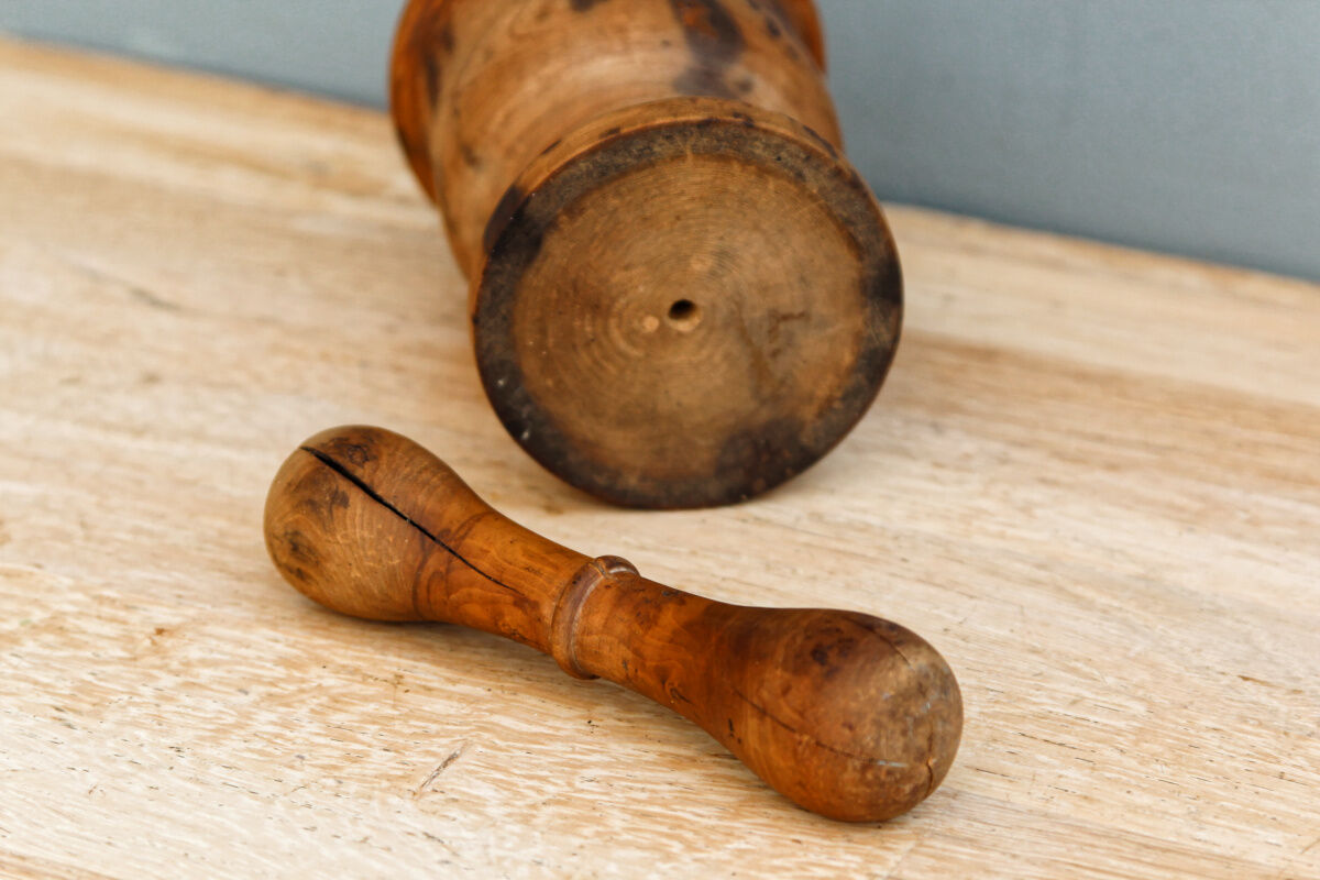 Ancient mortar and pestle, solid wood
