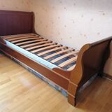 Bed with cherry wood base and bedside table