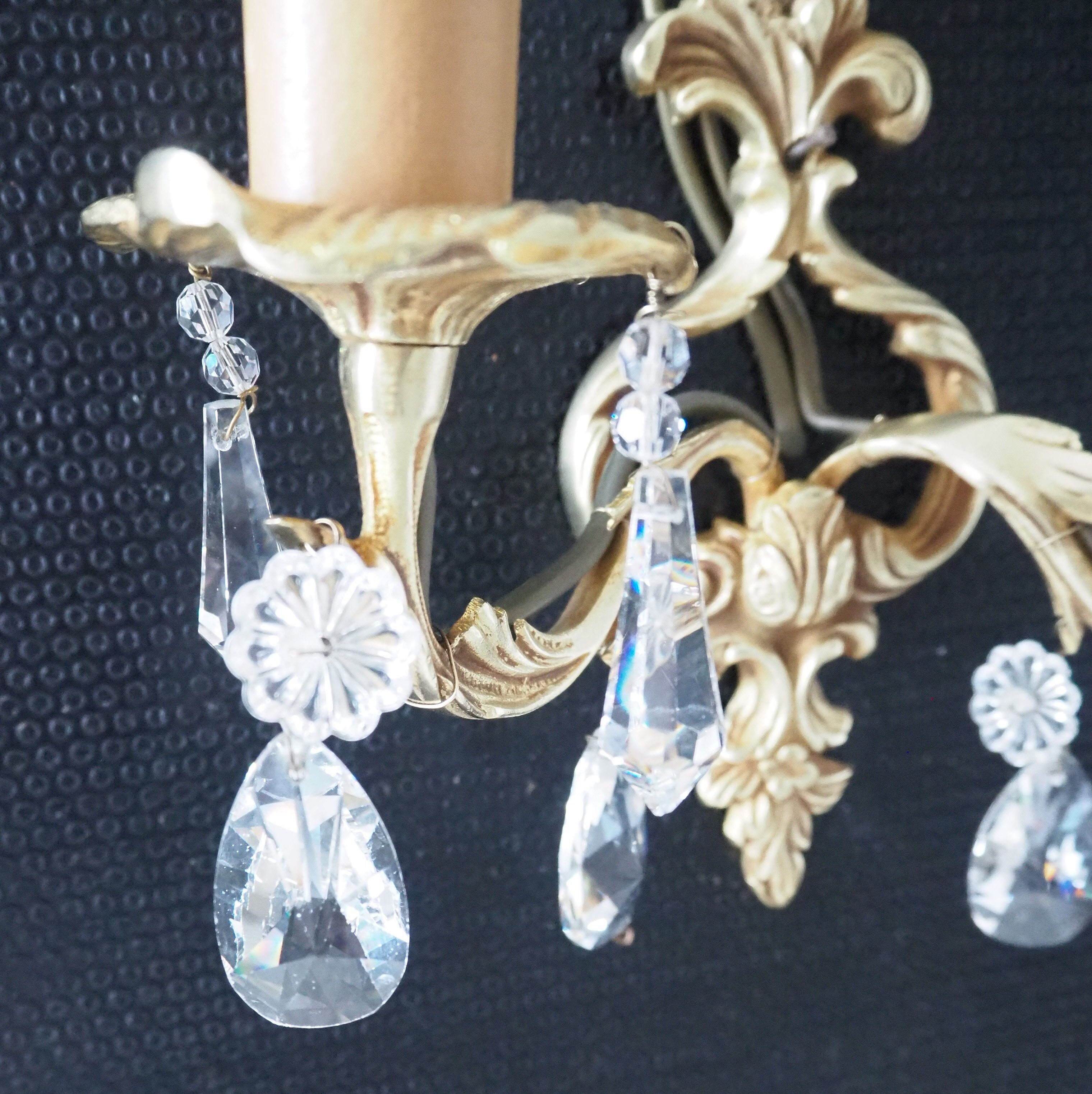 Pair of gilded bronze sconces and crystal pendants