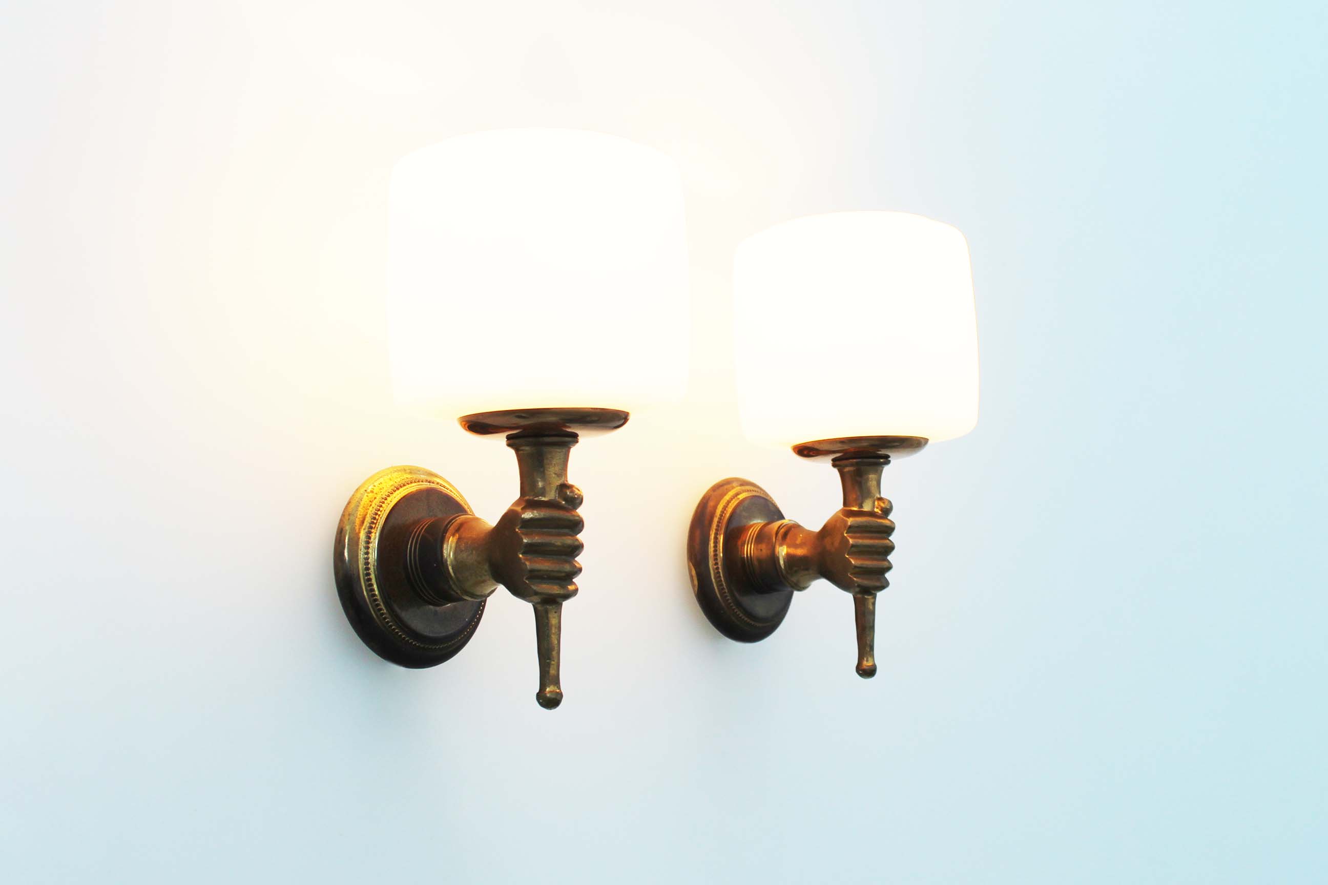 Pair of 1950’s solid brass ‘torch holding hand’ wall sconces by maison arlus