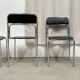 4 chrome metal chairs with black faux leather, 1990