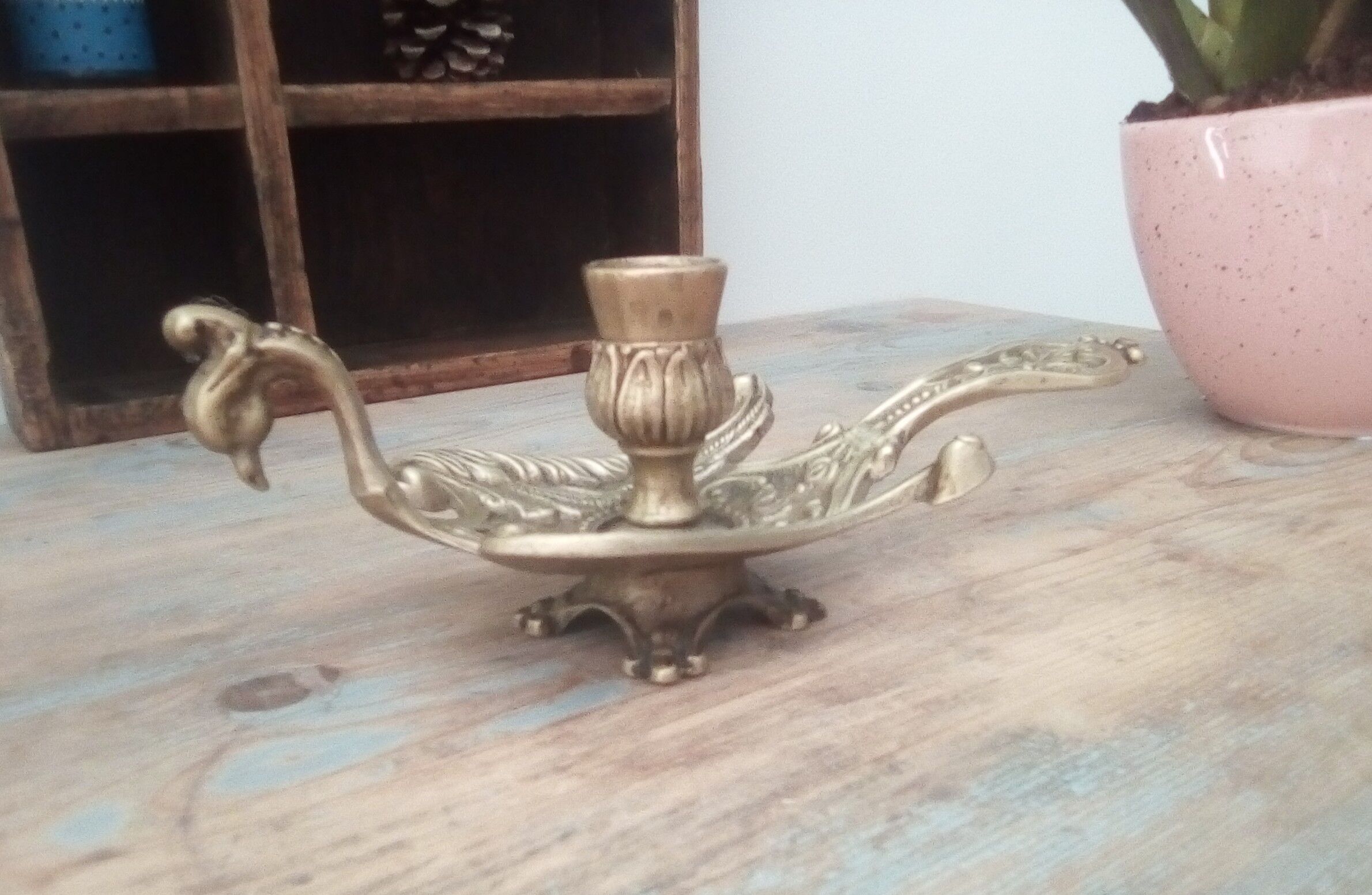 Old hand candlestick in chissed solid brass