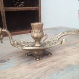 Old hand candlestick in chissed solid brass