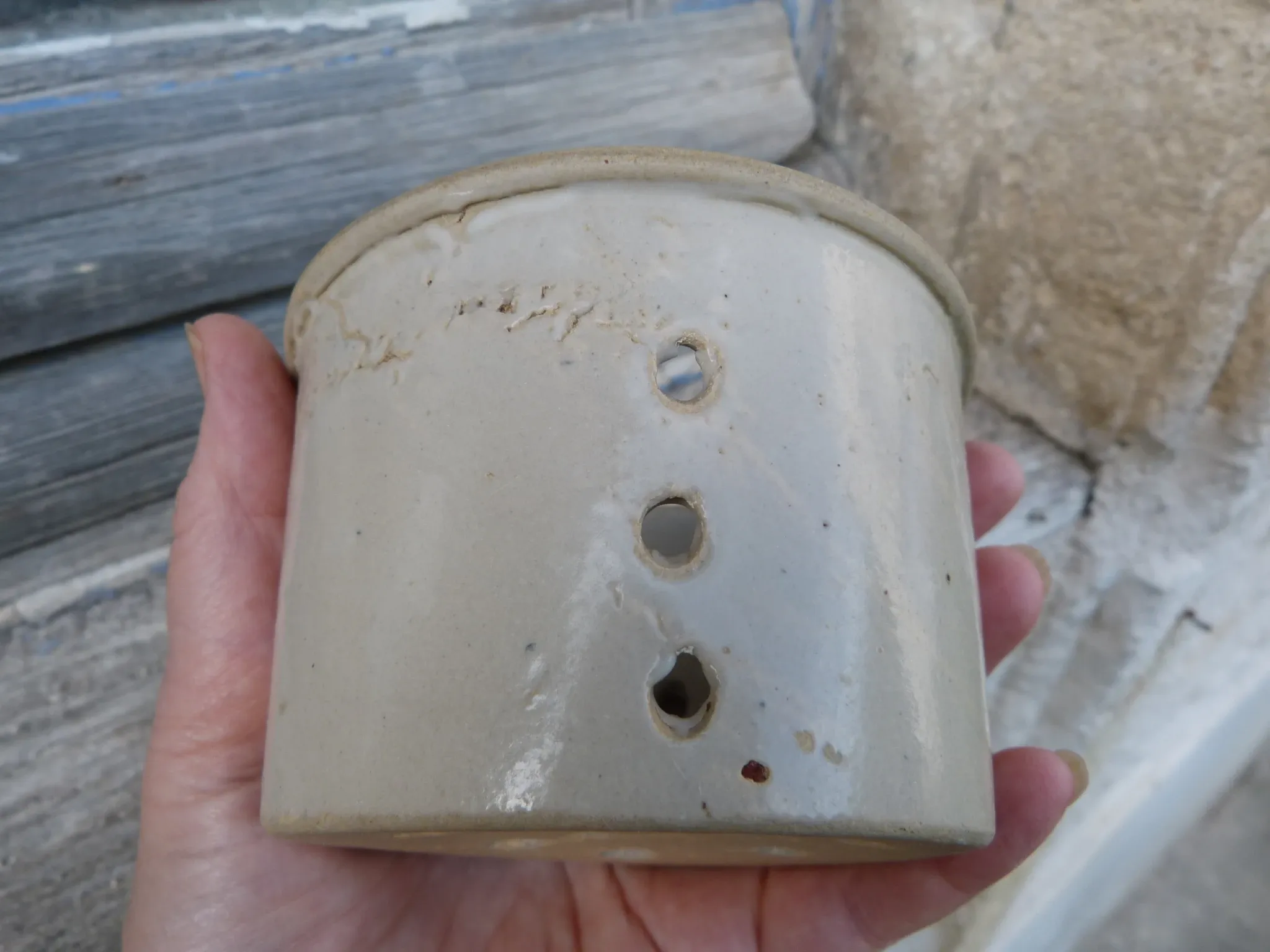 Beige stoneware cheese drainer