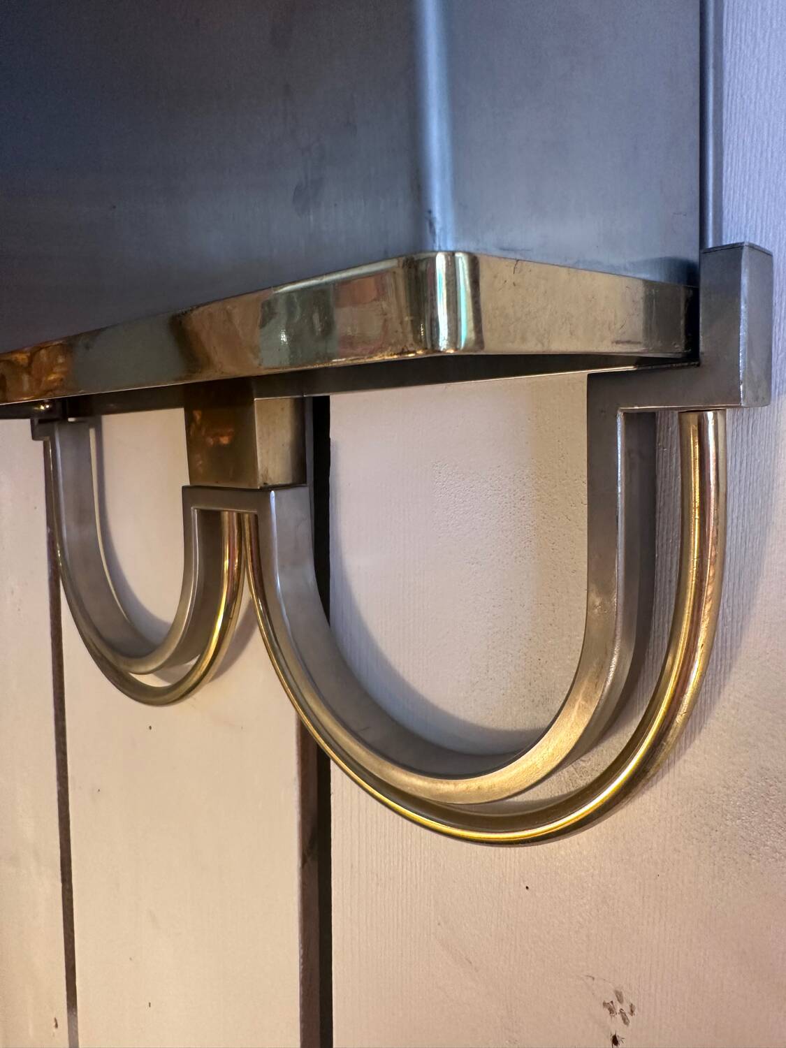 Pair of stainless steel and brass wall lights