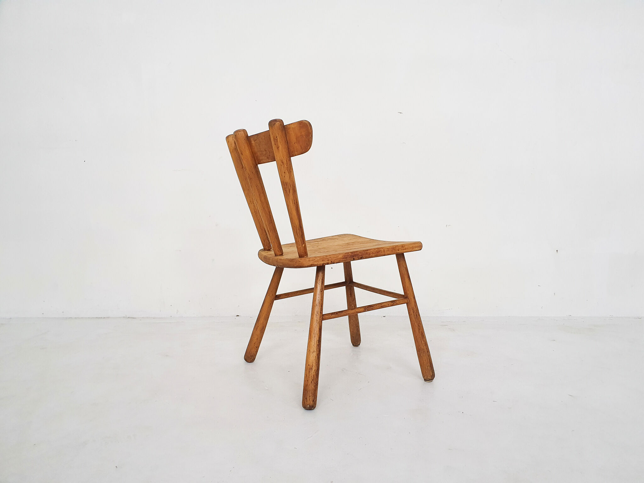 Scandinavian birchwood spindle back chair in the style of Ingvar Hildingson, Sweden 1950's
