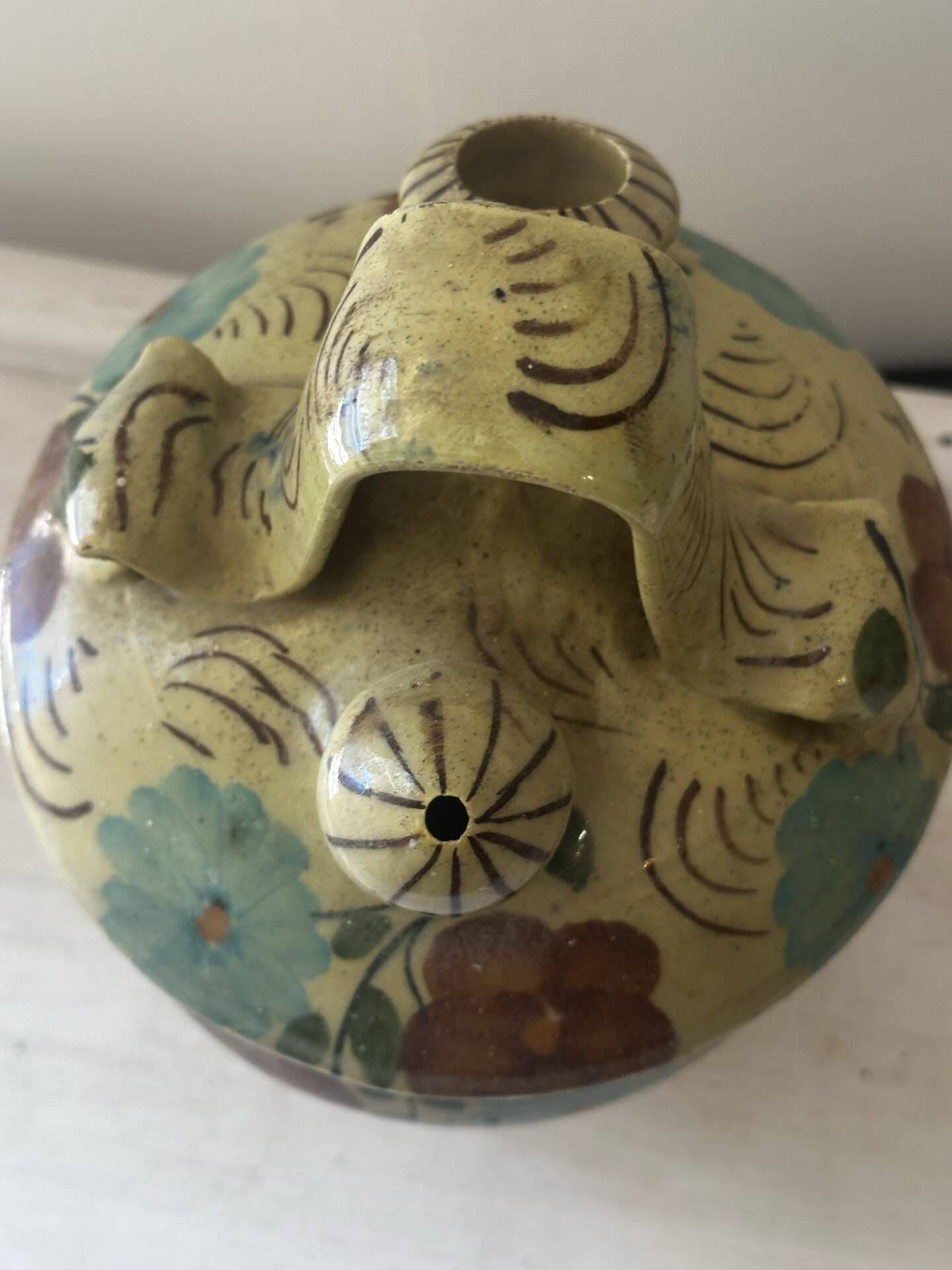 Mediterranean ceramic jug with floral decoration.