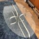 Oval glass coffee table with chrome legs, vintage 70s design.
