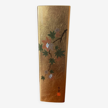 Japanese golden vase with maple leaves