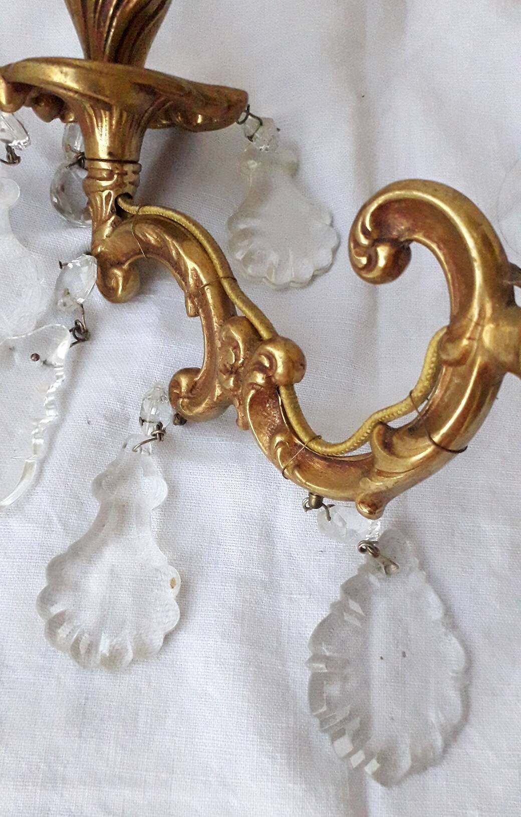 pair of bronze wall lights with pendants