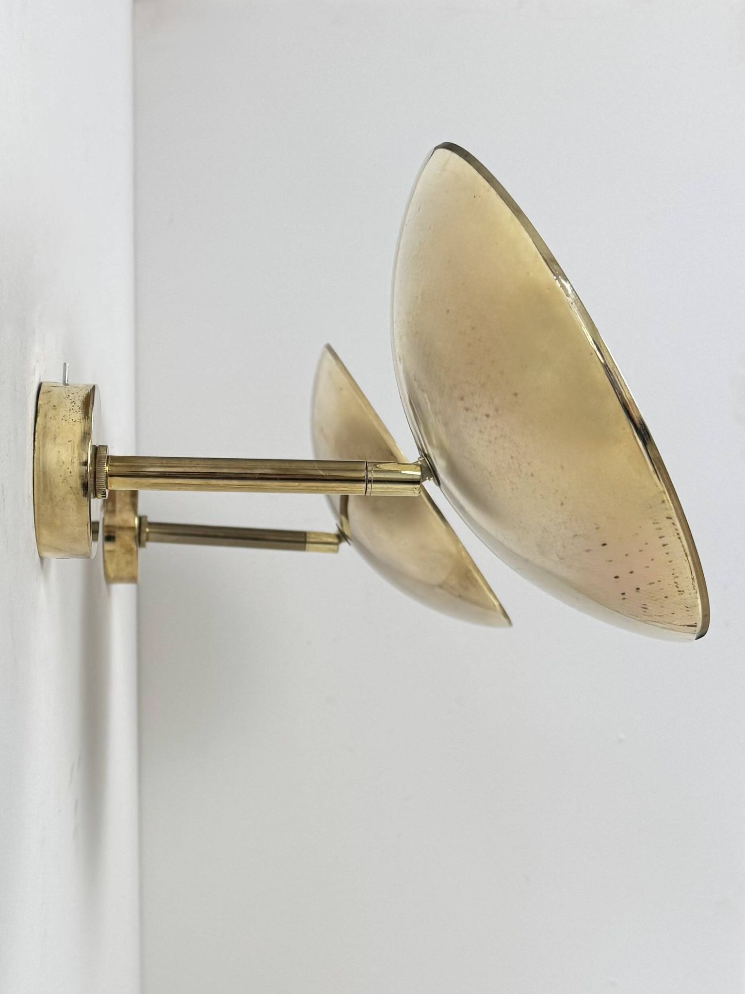 Pair of adjustable vintage wall lights, patinated brass, France, 1970.