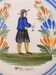 Assiette en faience hr quimper décor de breton