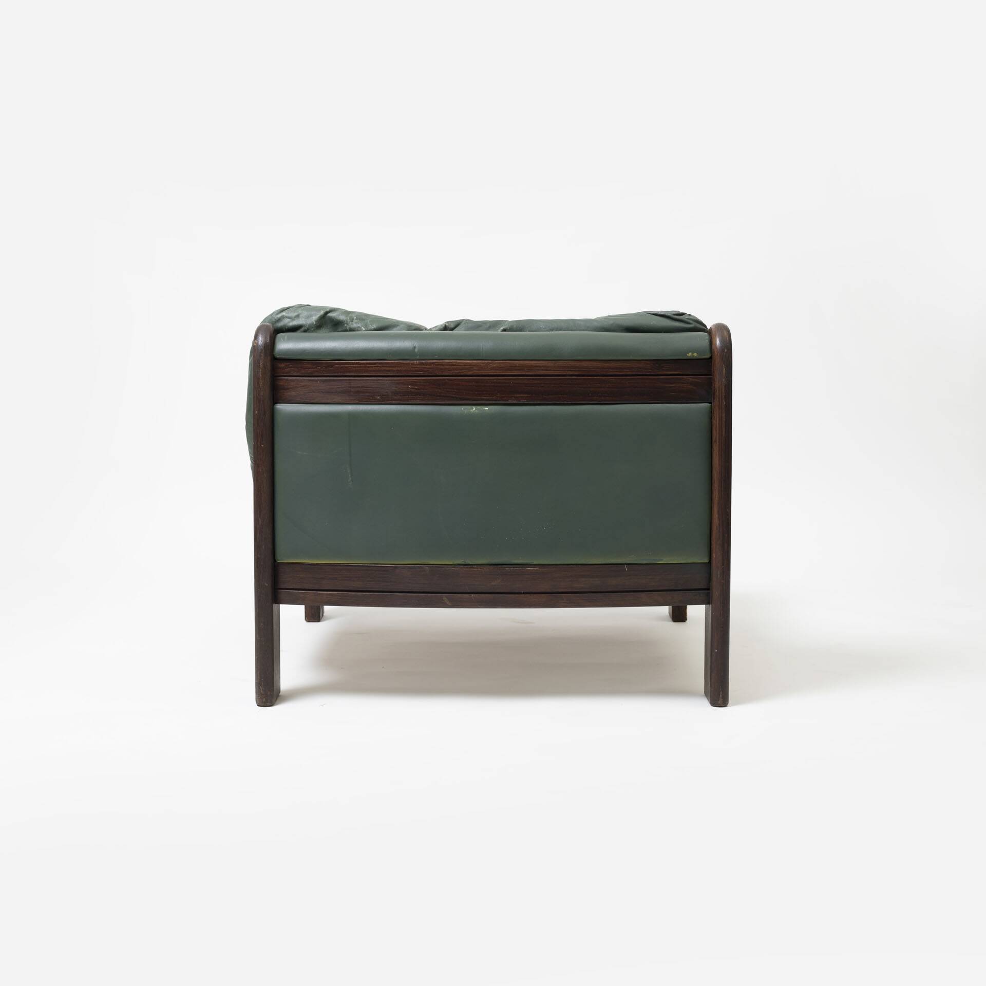 Pair of low sling chairs in hardwood and leather, Germany, 1970s