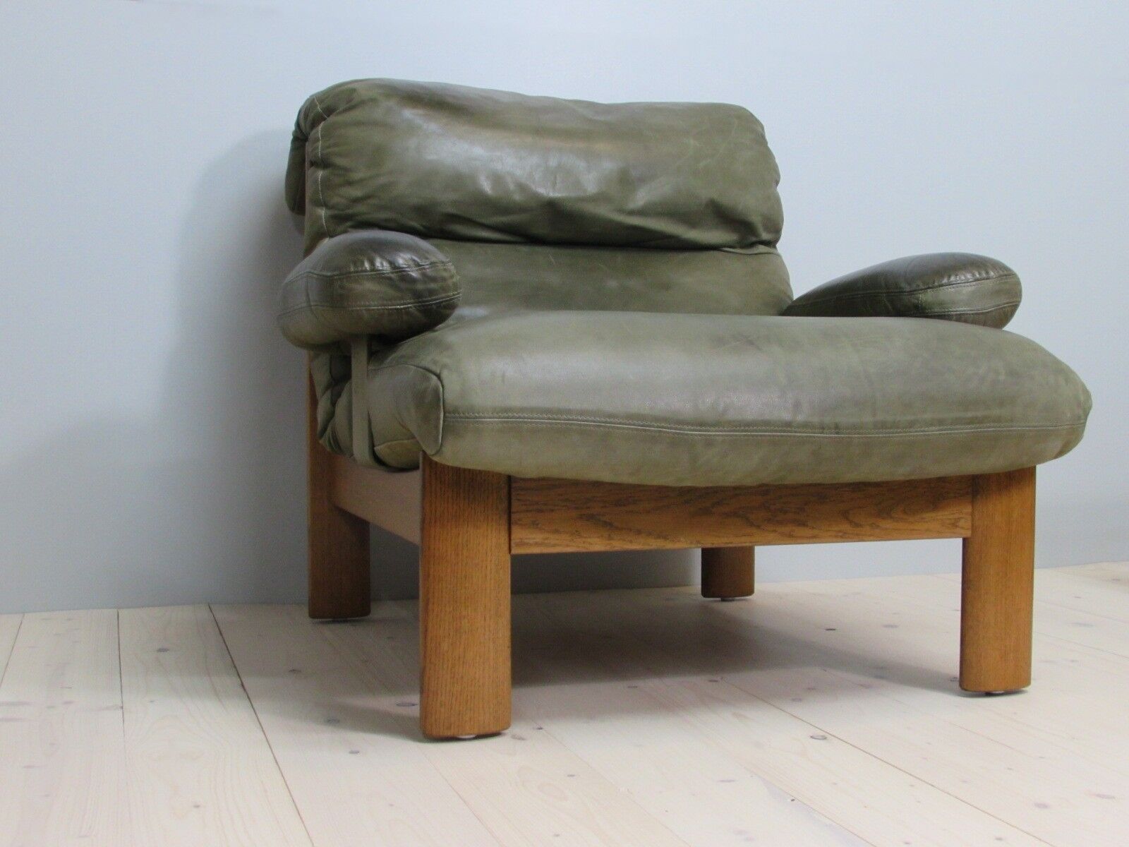 Armchair and footstool - green leather - 1960s