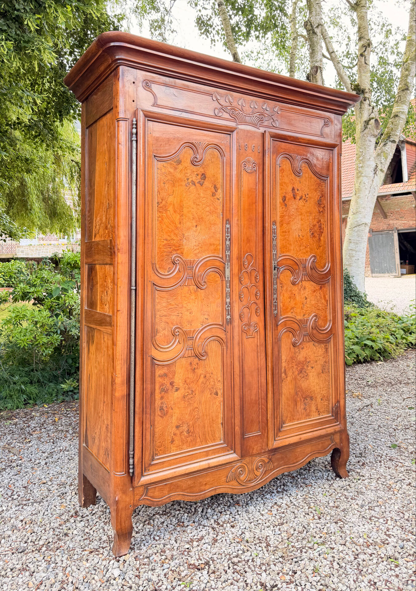 Bressane wardrobe in walnut in Louis XV style, 19th century.