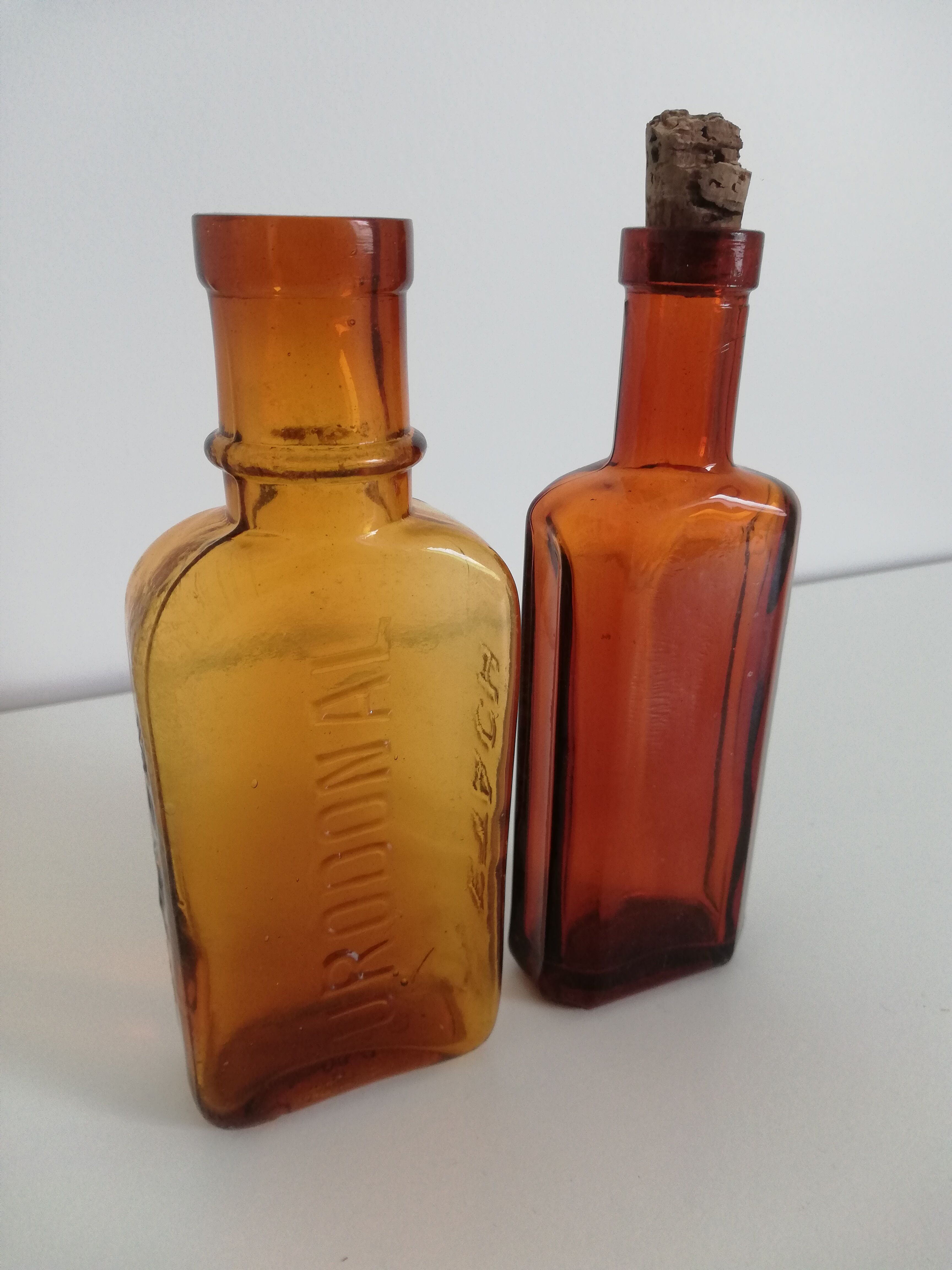 2 amber apothecary bottles