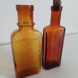 2 amber apothecary bottles