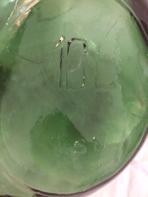 Demijohn with a beautiful glass mixing green and brown