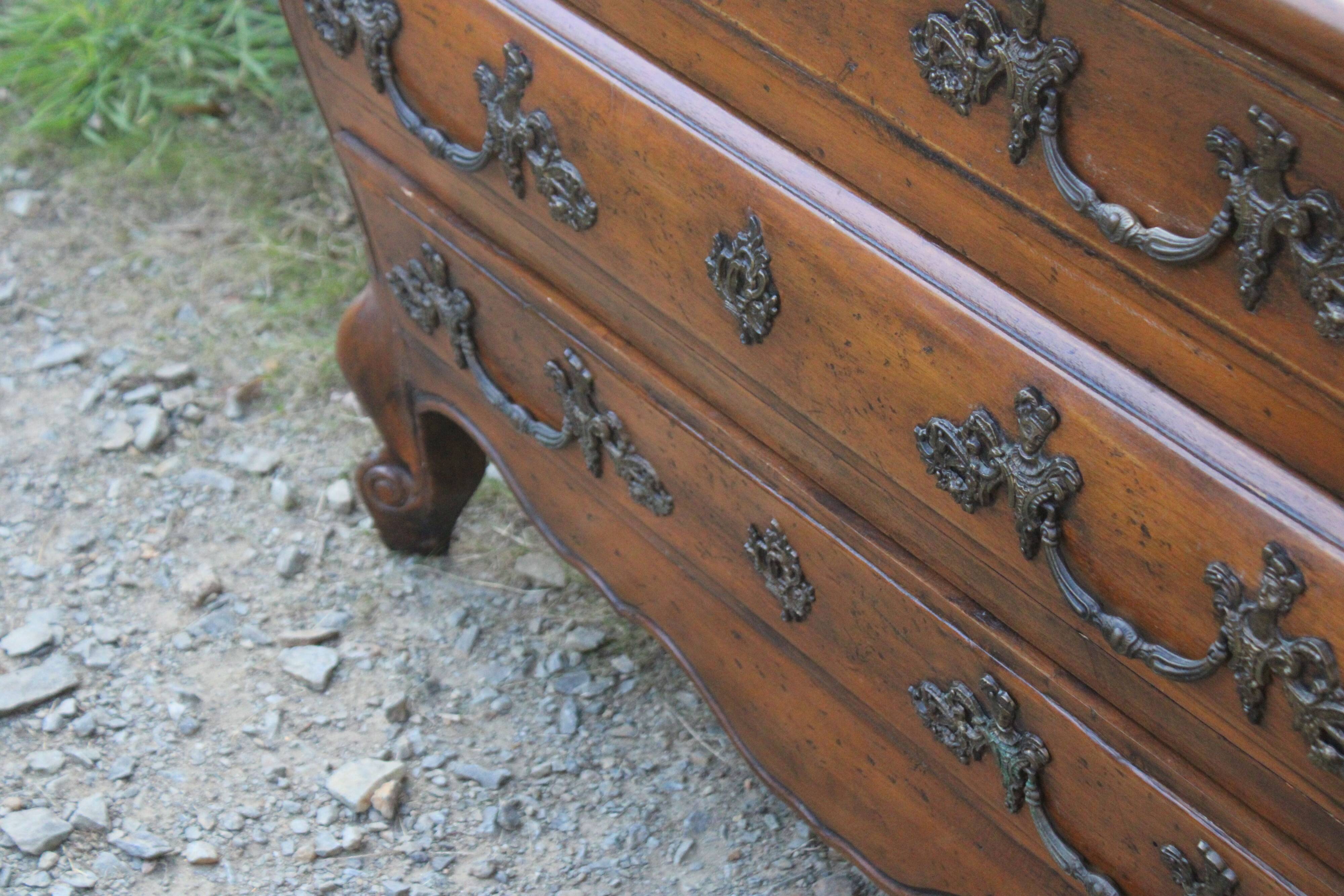 Curved Louis XV style chest of drawers known as a “tomb”