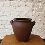 Old red and black terracotta grease pot