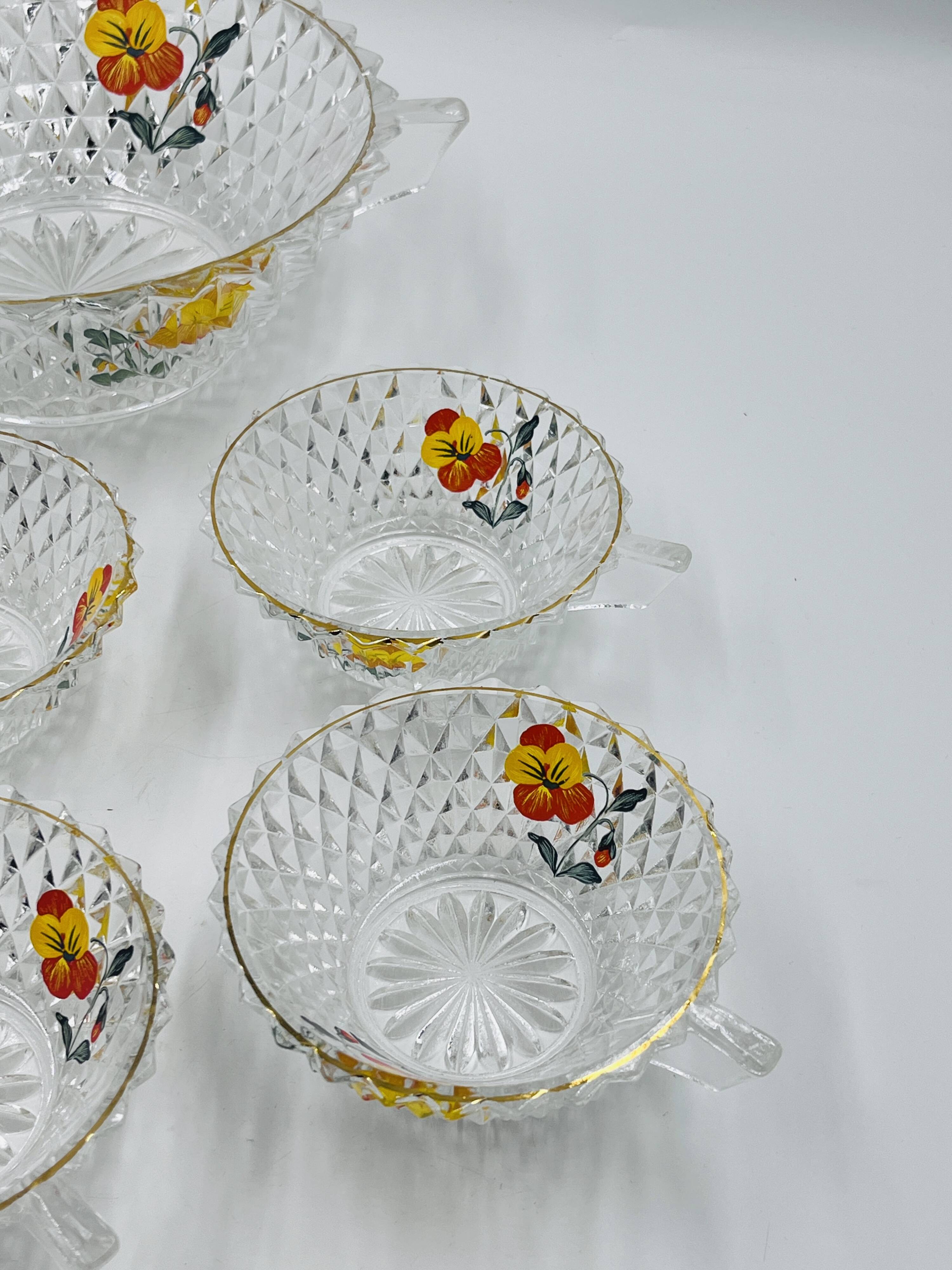 Vintage glass fruit salad serving set with a pansy design.