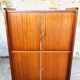 Storage cabinet with double compartment, metal feet circa 60's