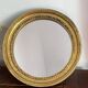 Miroir rond en bois de couleur dorée