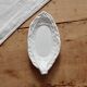 Antique leaf-shaped white English slipware dish.