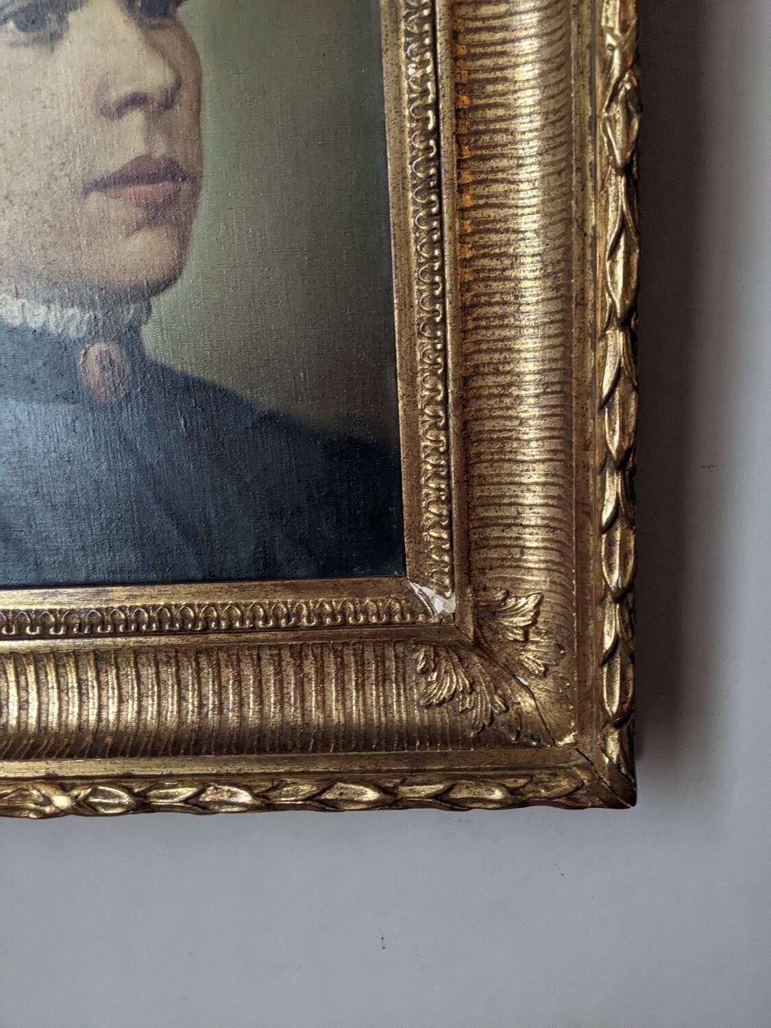Oil on canvas portrait in an antique gilded wooden frame.