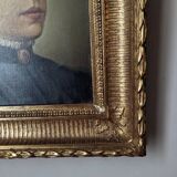 Oil on canvas portrait in an antique gilded wooden frame.