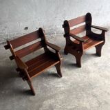 Set of two dark brown solid wood brutalist sculptural chairs with carved details