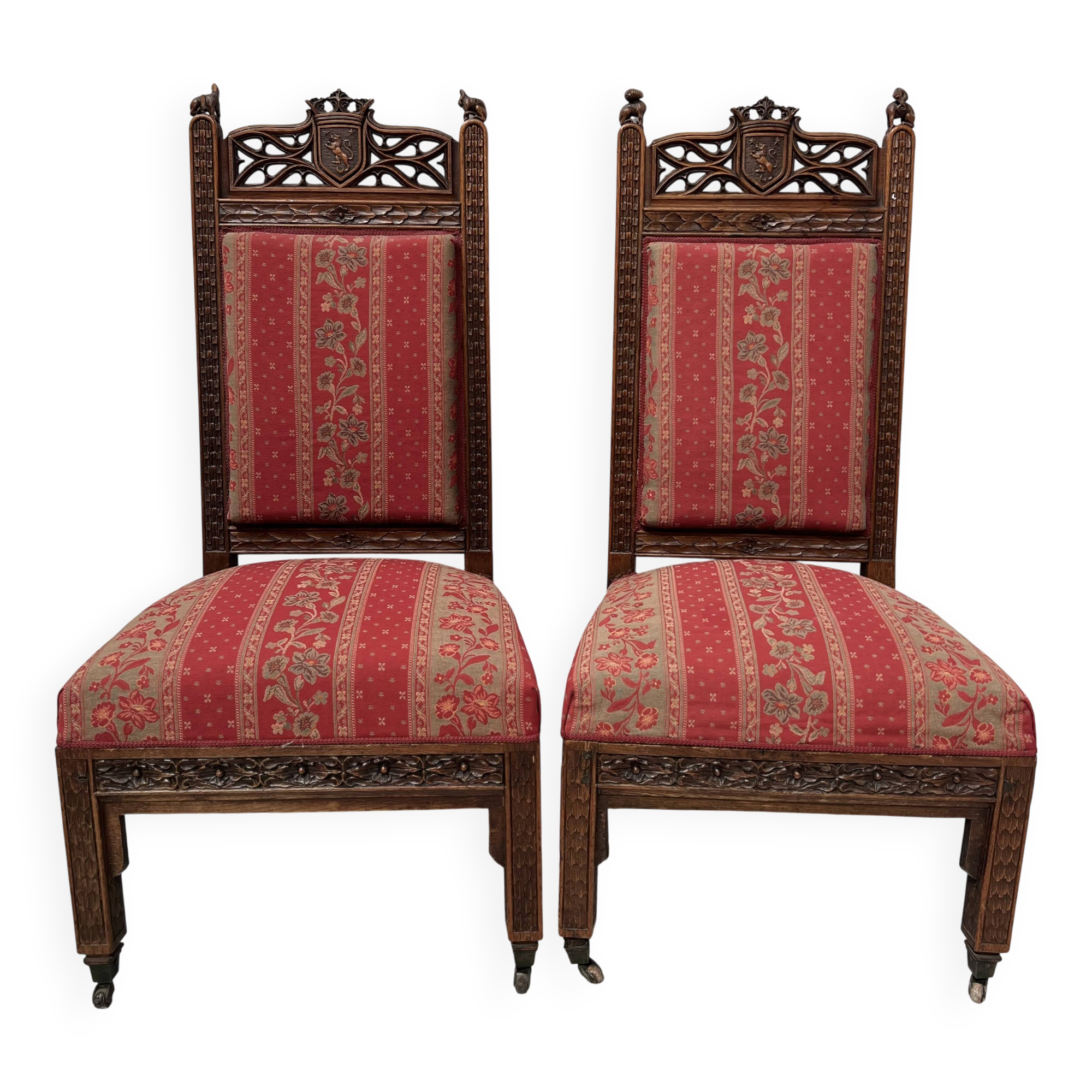 Pair of Gothic-style walnut lounge chairs, 19th century
