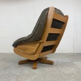 Brutalist oak and leather swivel chair, 1970s