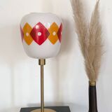 Table lamp with a vintage orange and red "Jacquard" globe in white glass and a golden base