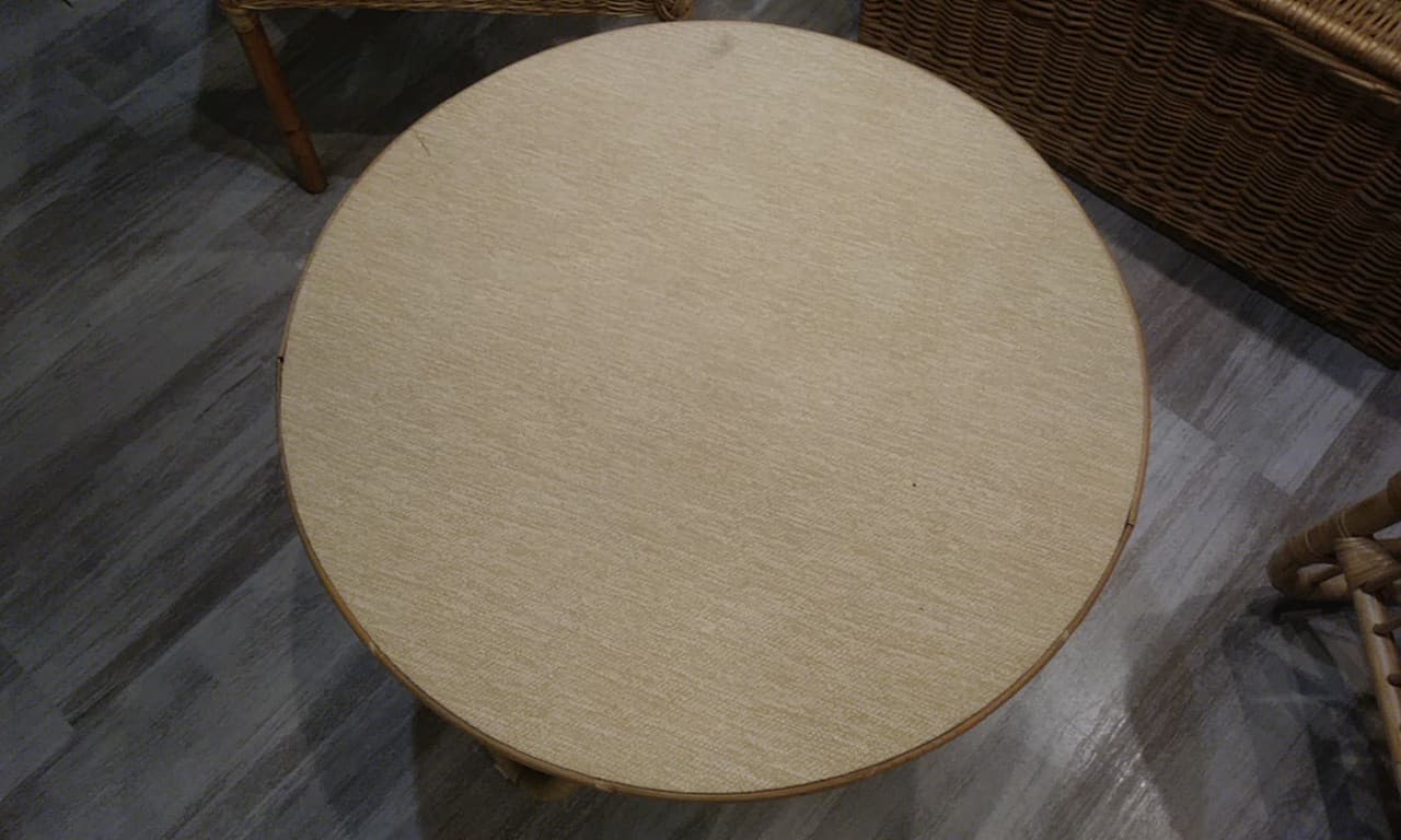 Round coffee table in old rattan