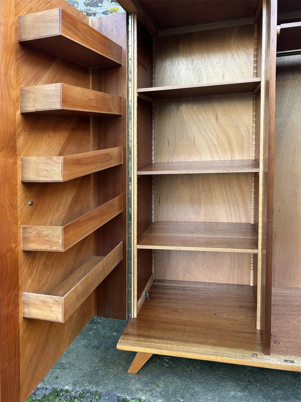 Mid-century wardrobe from the 1960s in wood, with a chevron front and tapered legs.