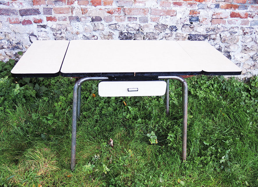 Old extendable table in yellow formica