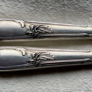 Set of 12 silver-plated metal table knives in Art Nouveau style.