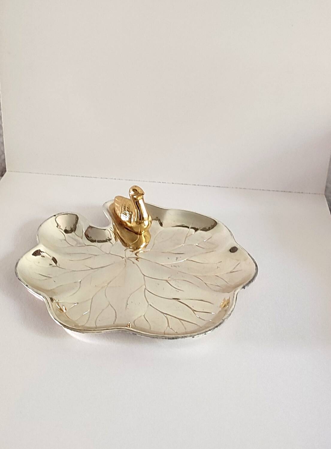 A Lancel pocket tray in silver metal.