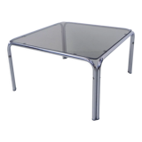 Coffee table with smoked glass top in chromed frame