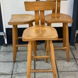 Trio of bent pinewood bar stools