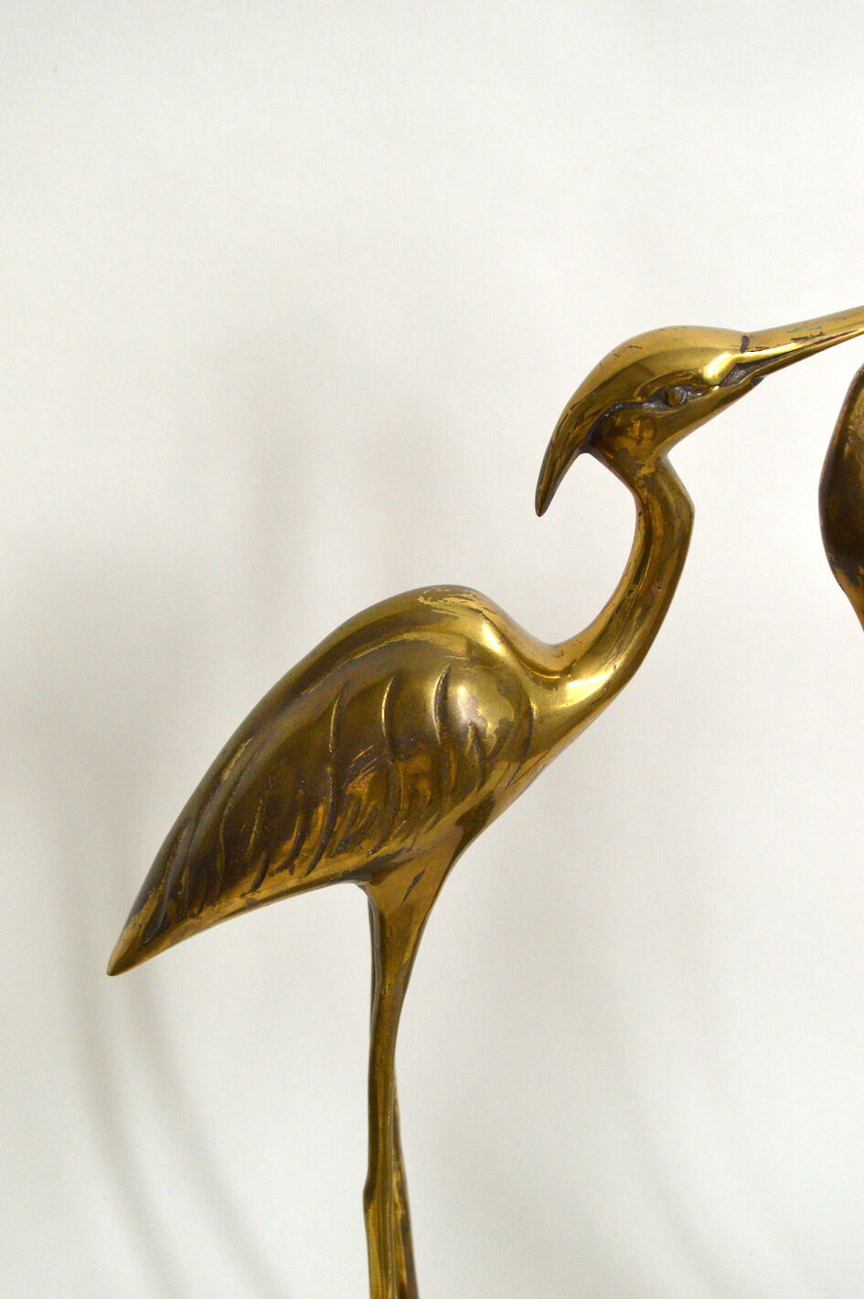 Brass herons couple