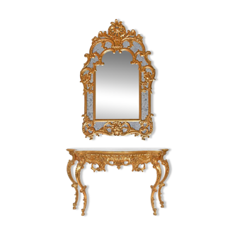 Console with a gilded wood mirror in Rococo style.